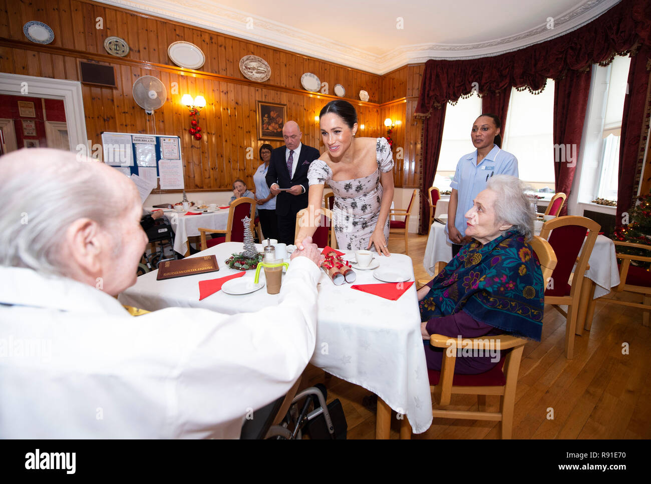 The Duchess of Sussex meets Dr Stuart Ward and actress Josephine Gordon during a visit to the Royal Variety Charity's residential nursing and care home, Brinsworth House, in Twickenham, west London. Stock Photo