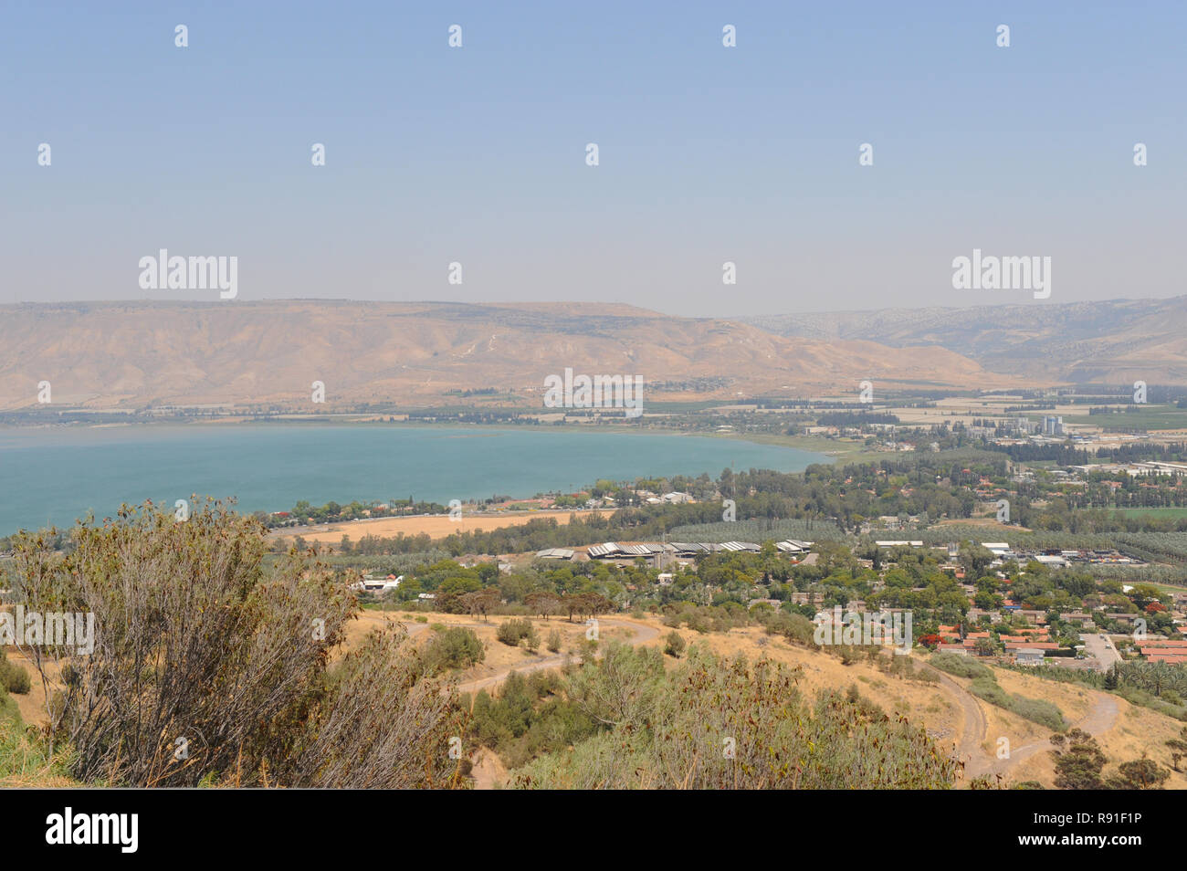 Historical lowest freshwater Biblical lake Kinneret Sea of Galilee of Israel feeding water to surrounding areas making land fertile for agriculture. Stock Photo