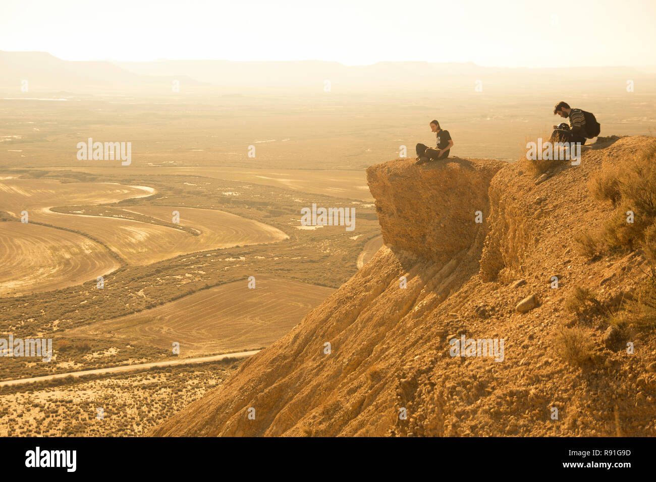 Friends at sunset in Bardenas Reales, Navarra Stock Photo