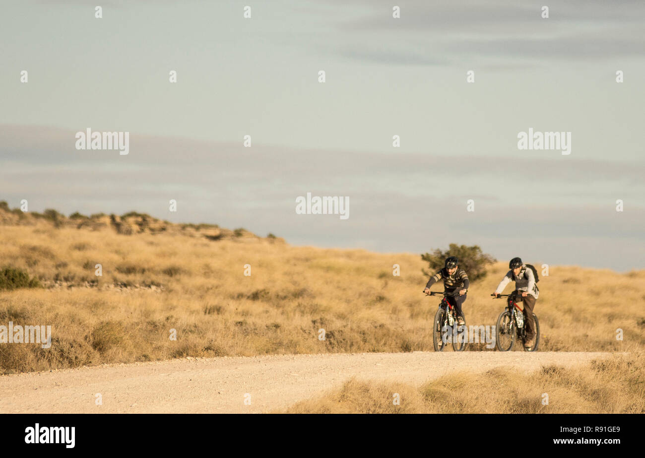 Biking in Bardenas Reales, Navarra (Spain) Stock Photo