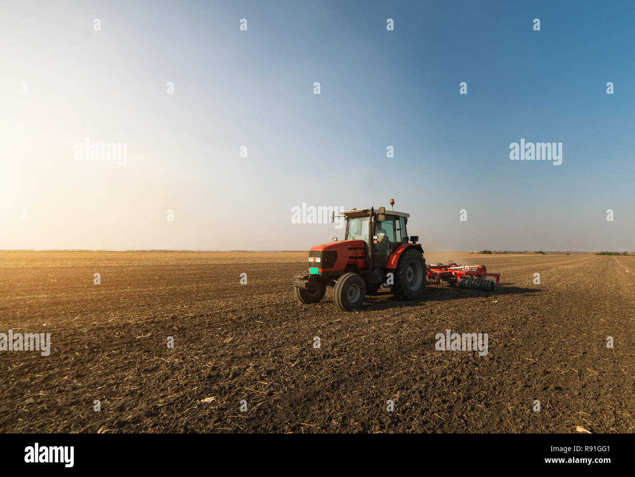 Tractors Plowing Stubble Fields Stock Photo Alamy