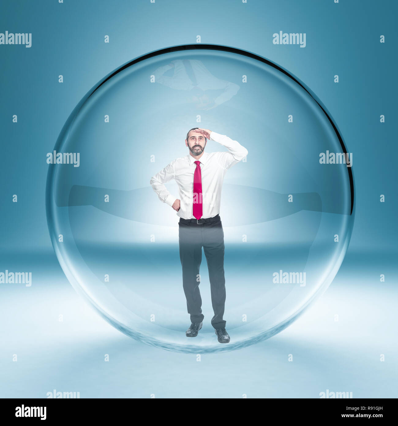 caucasian businessman standing in a glass bubble Stock Photo