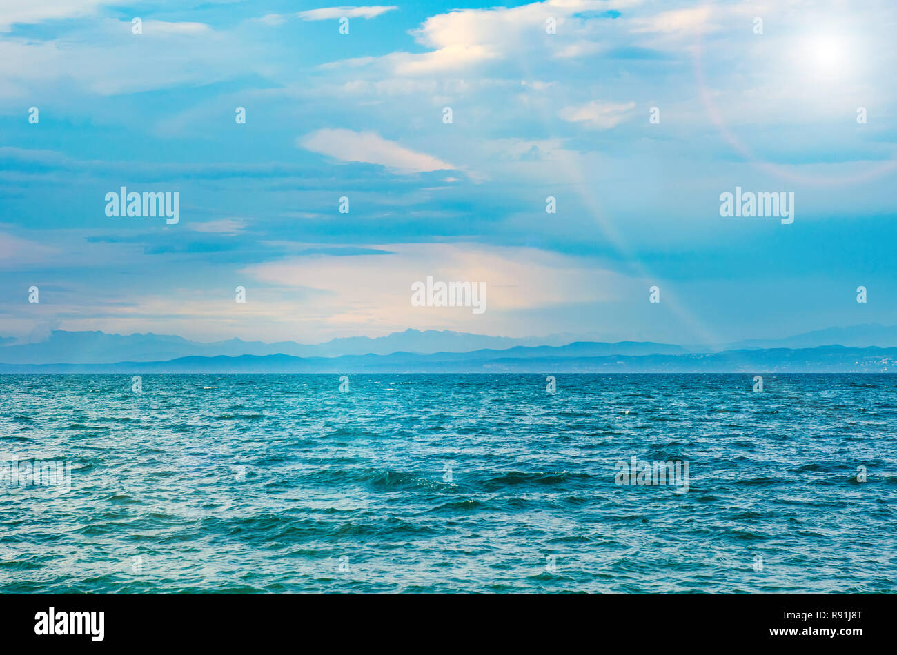 seascape with waves, sun and sky Stock Photo - Alamy