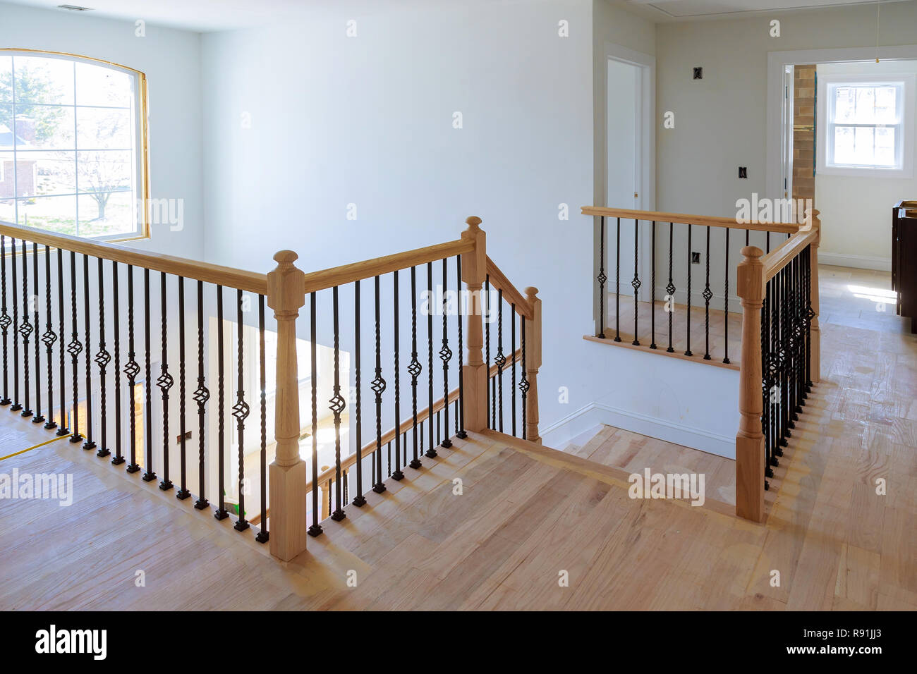 Hallway interior with hardwood floor. View of wooden stairs Stock Photo
