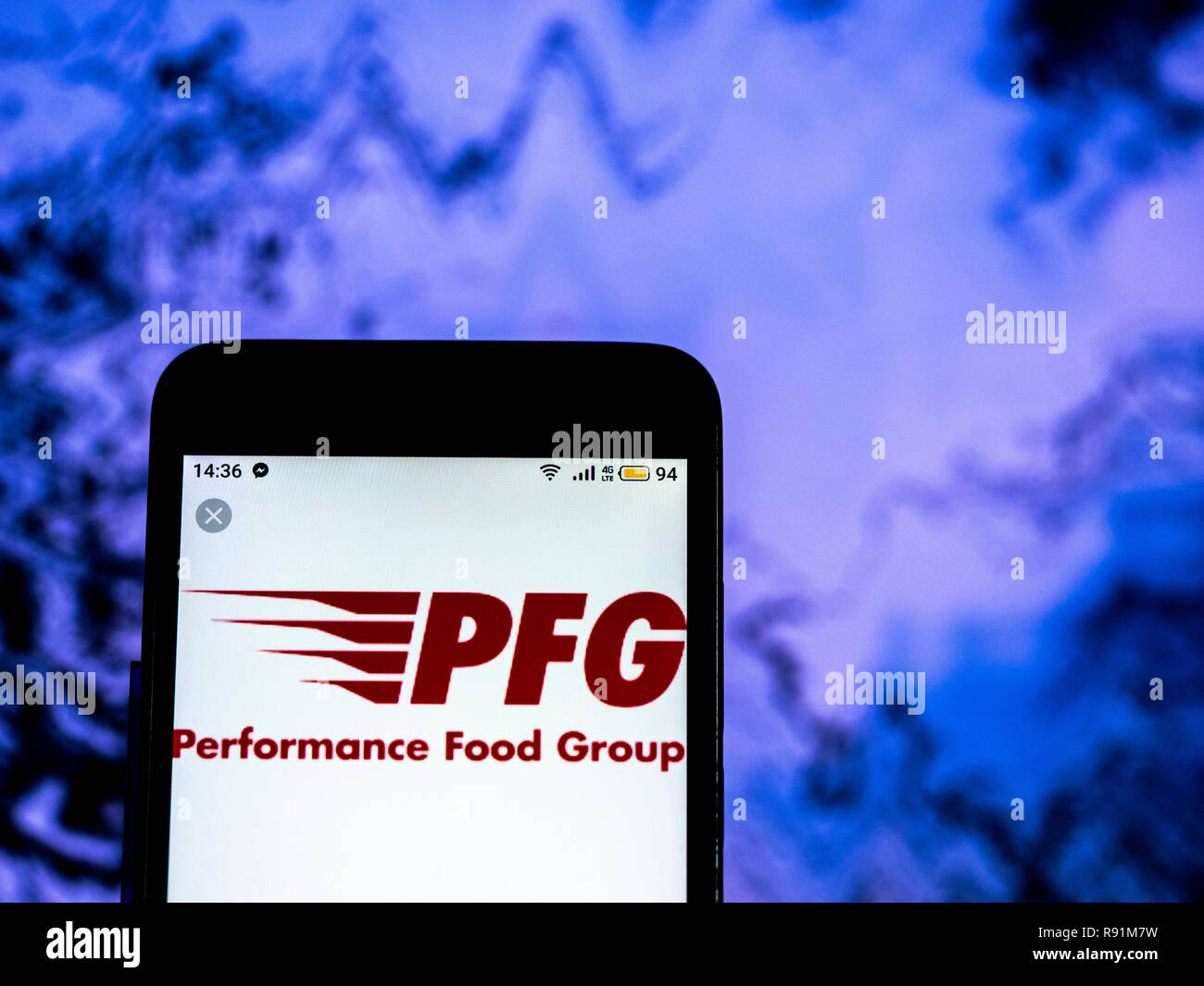 Performance Food Group Company logo seen displayed on smart phone Stock
