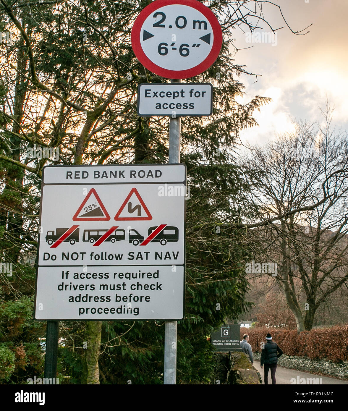 Sign leaving Grasmere village warning drivers of long/large vehicles to avoid following Sat Nav up the steep and narrow Red Bank road. Stock Photo