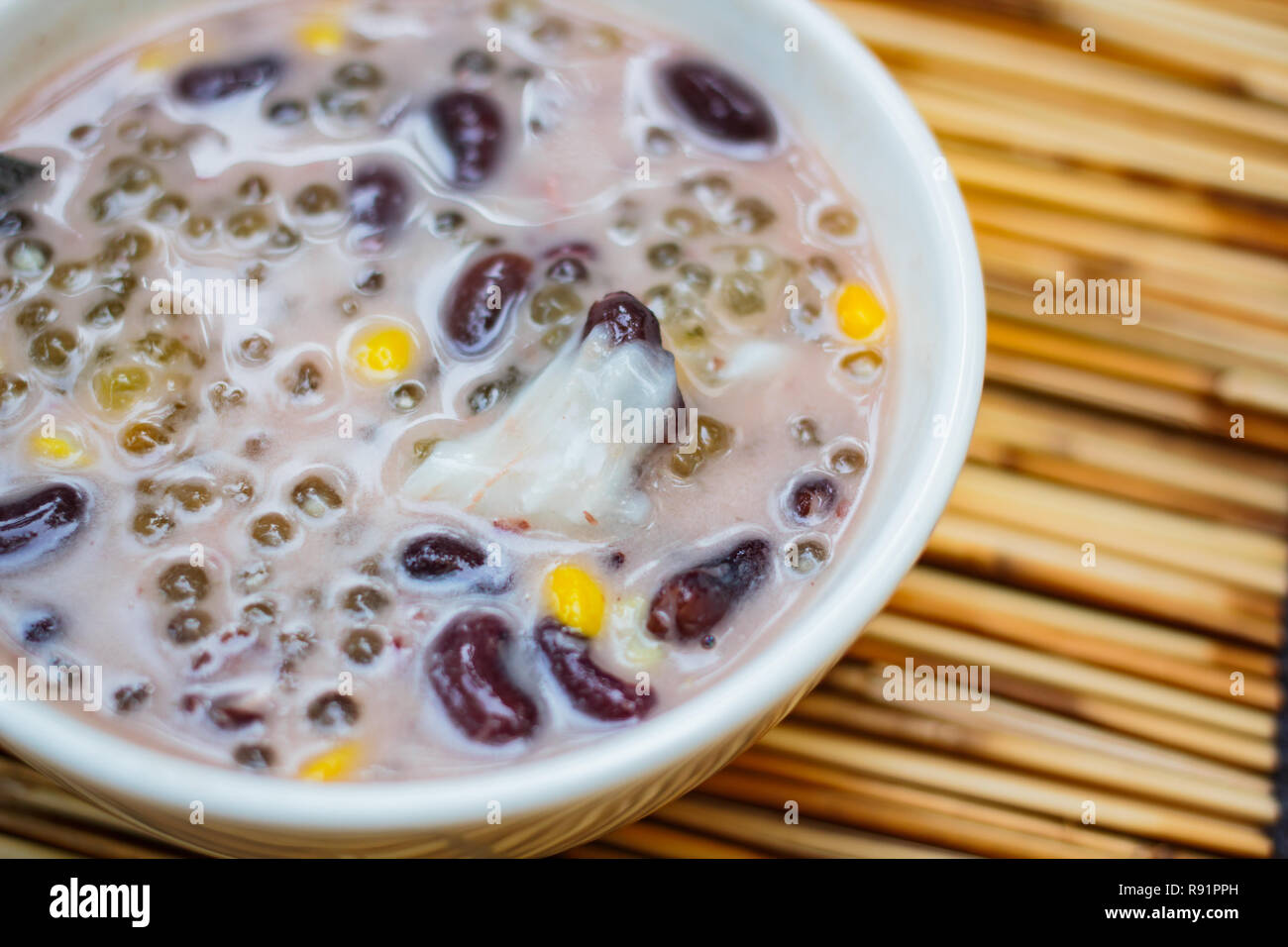 Sago and black beans in coconut cream with young coconut, Thai dessert Stock Photo Alamy