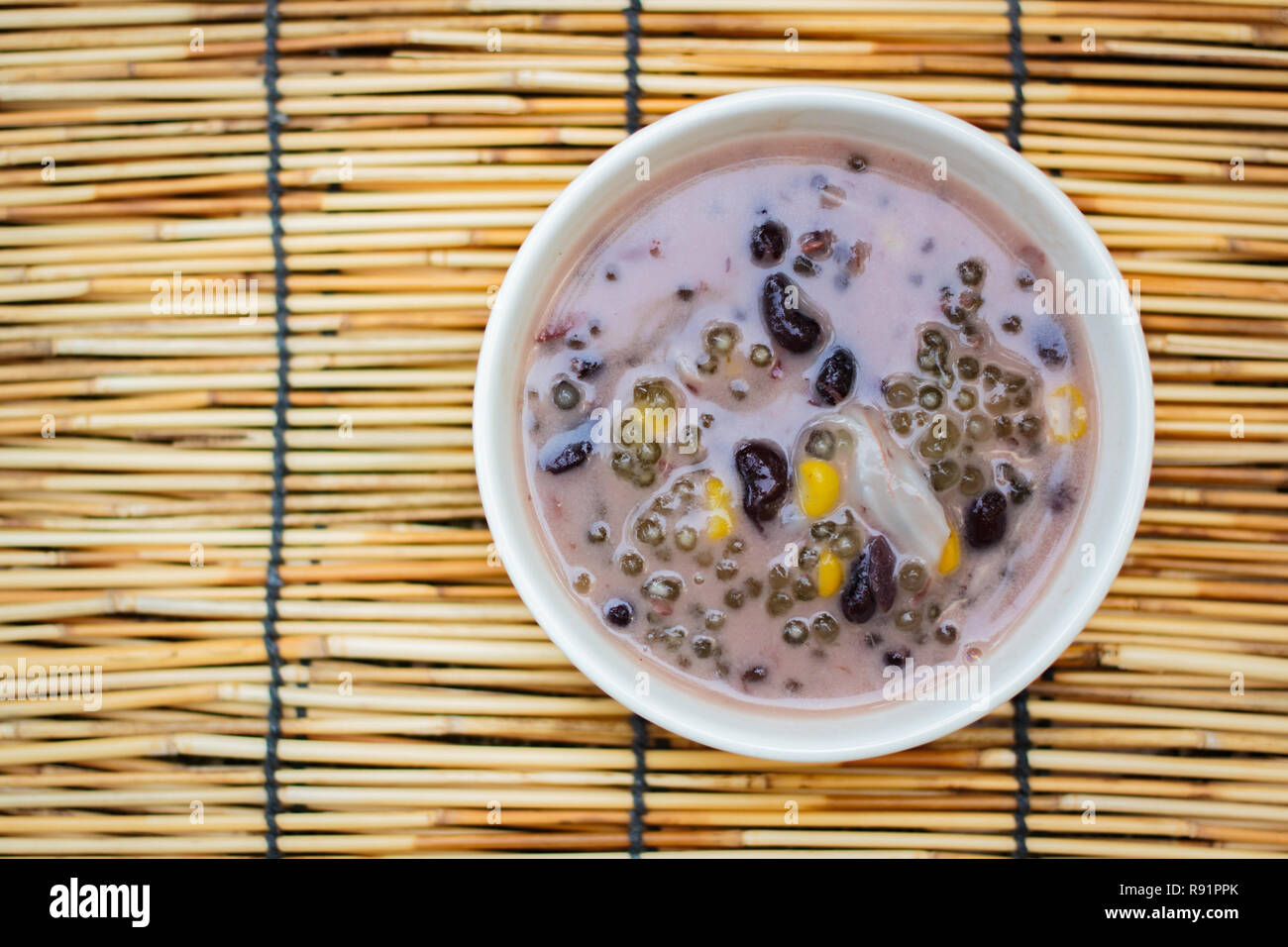 Sago and black beans in coconut cream with young coconut, Thai dessert Stock Photo Alamy