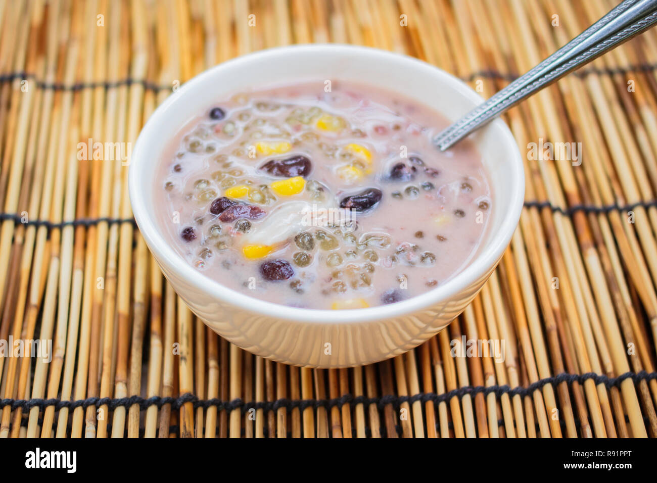 Sago and black beans in coconut cream with young coconut, Thai dessert Stock Photo Alamy