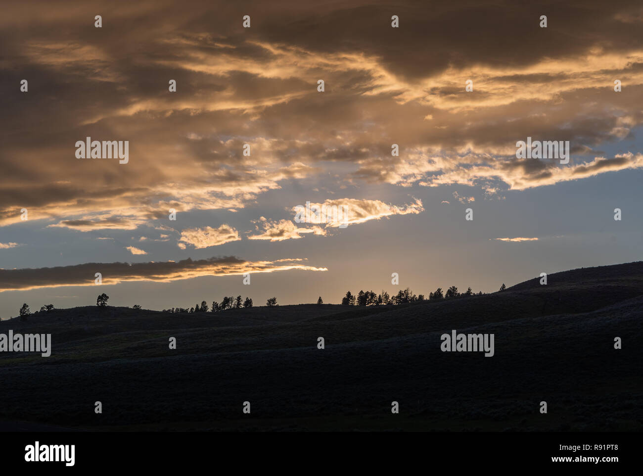 Clouds Over Silhouette of Rolling Hills in Wyoming Stock Photo - Alamy