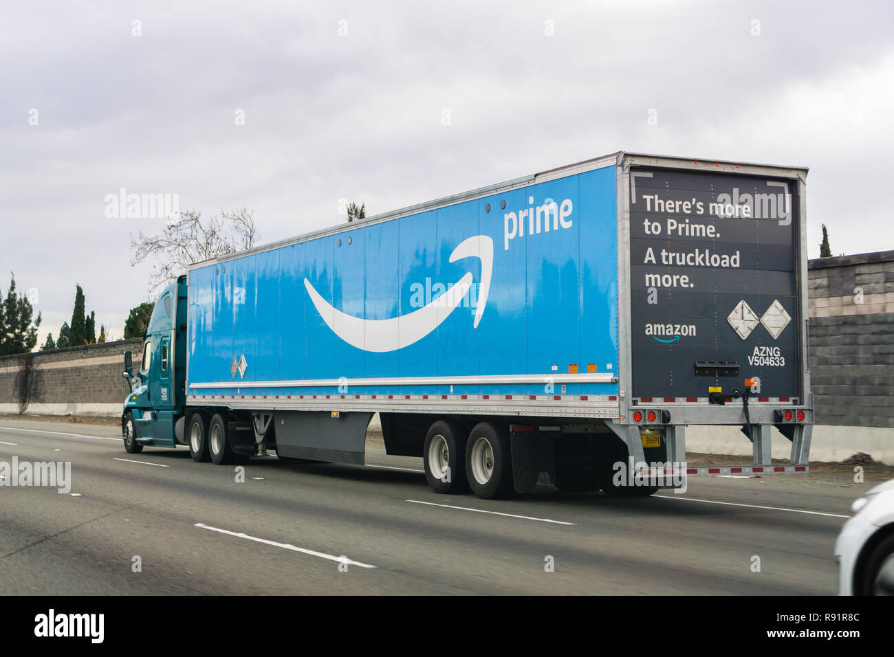 December 15, 2018 Fremont / CA / USA - Amazon truck driving on the freeway, the large Prime logo printed on the side; San Francisco bay area Stock Photo