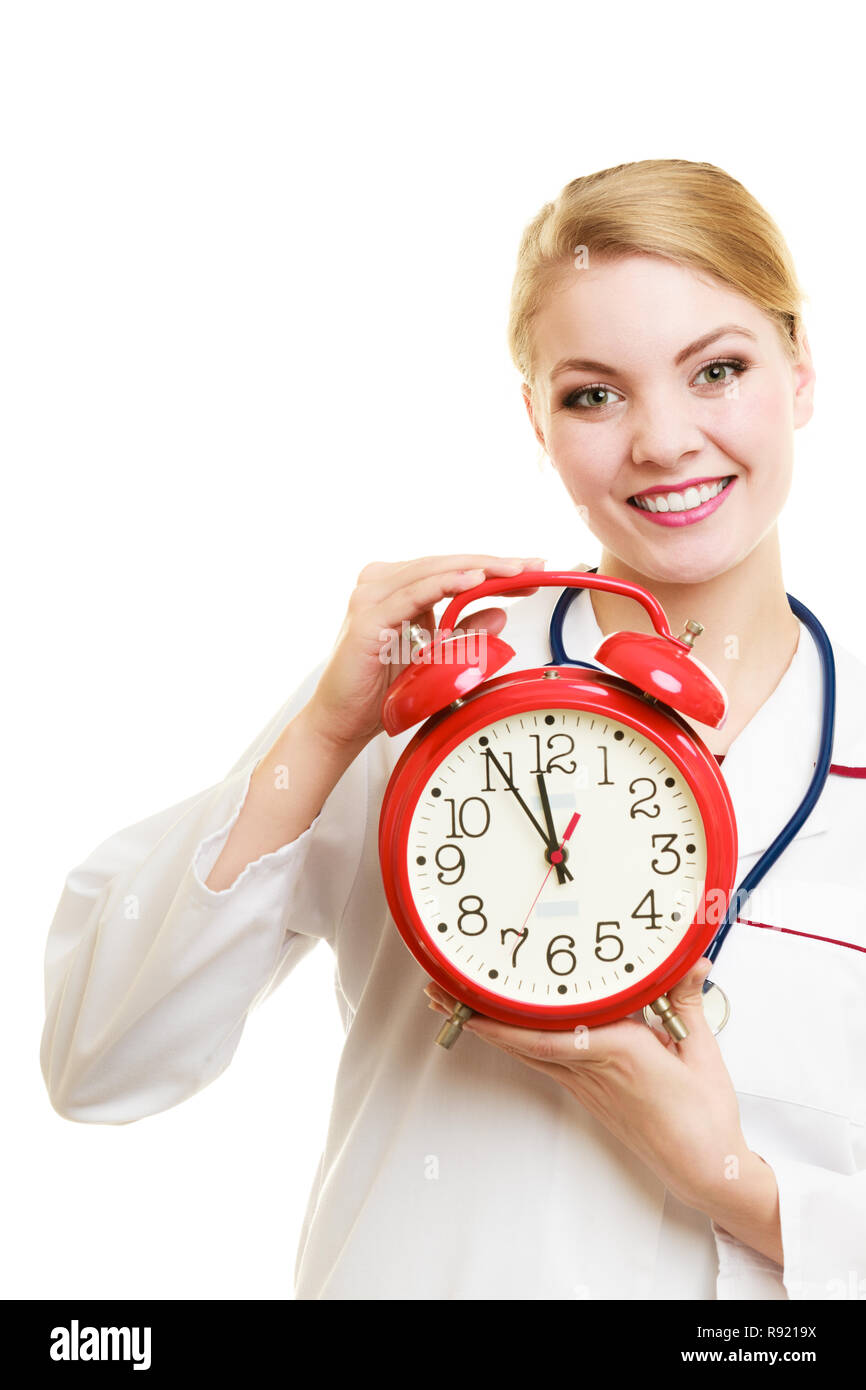 Health care medical checkup concept. Doctor with big red alarm clock