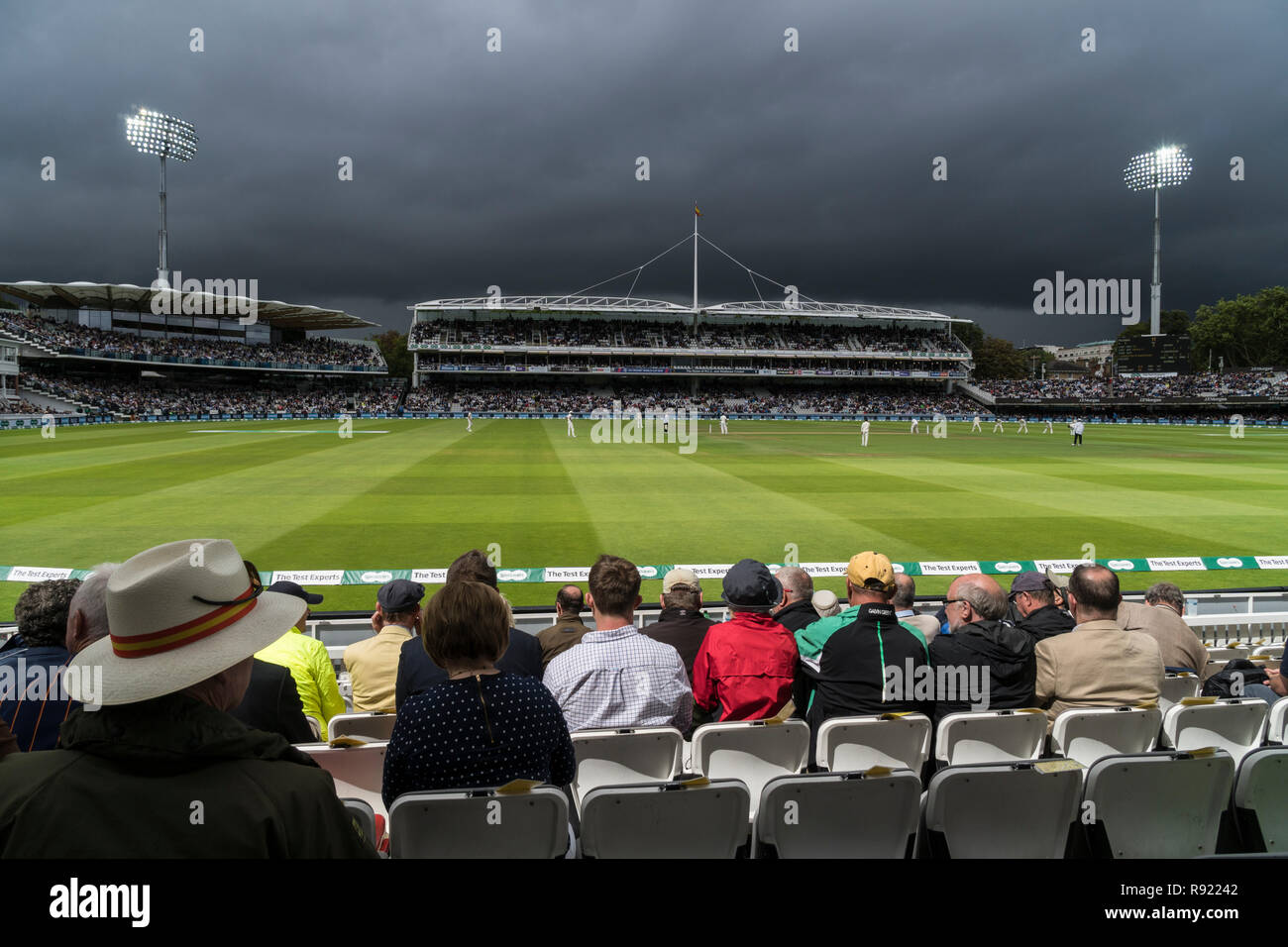 Under a threatening storm sky the 2018 test between England and India. The pitch is in bright sunshine but heavy rain is on its way Stock Photo