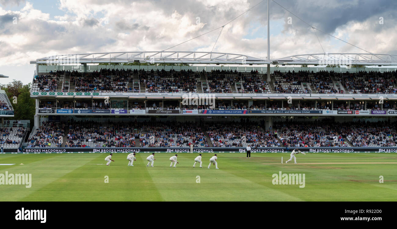 After almost 2 days of delays due to heavy rain the 2018 England v India test match at Lords continues in the evening session under dark skies Stock Photo
