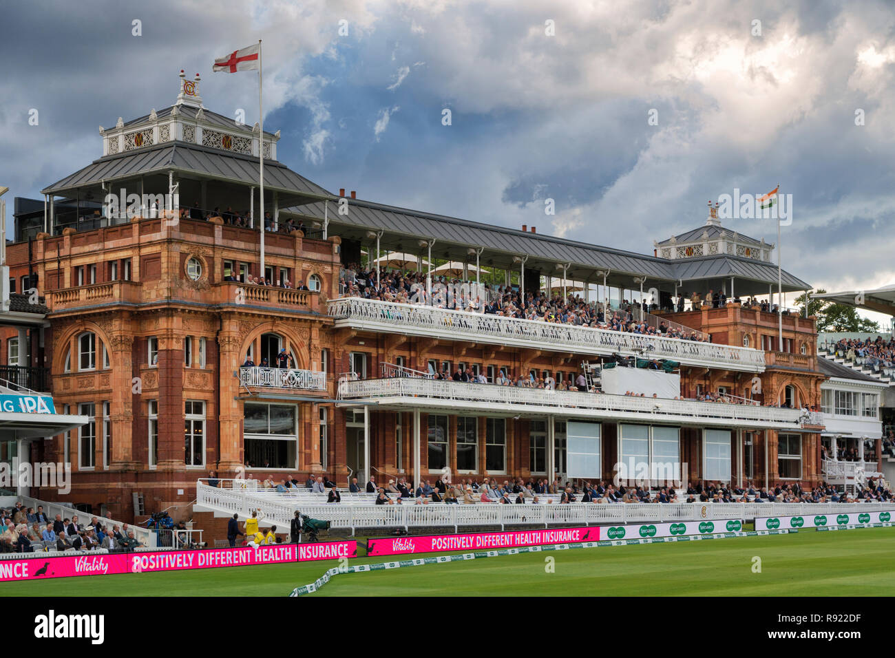 The Pavillon at Lords Cricket ground in dramatic evening light under a stormy sky during the England versus India test 2018 Stock Photo