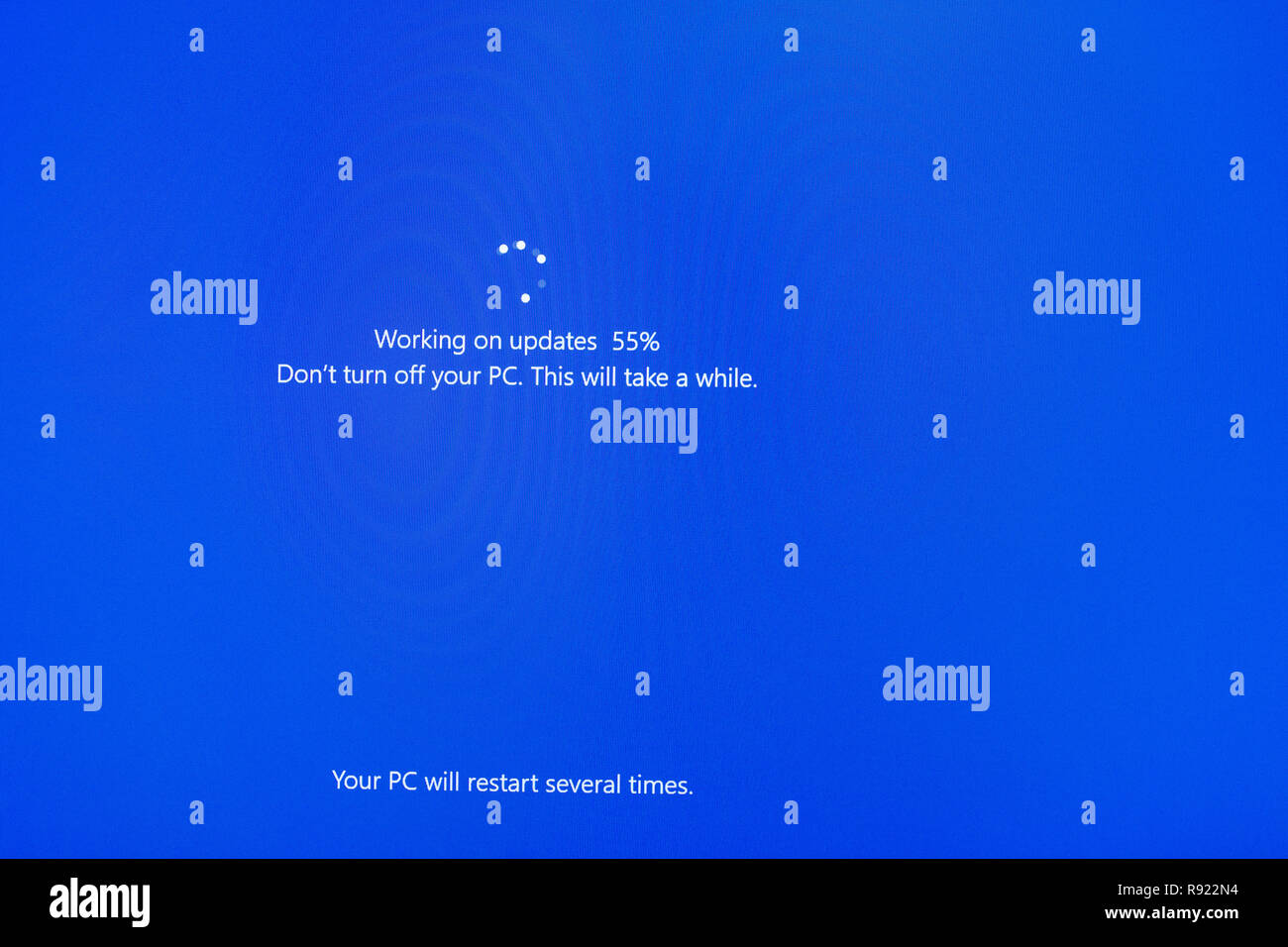 A common sight for Windows PC computer users is the  Windows 10 blue update screen Stock Photo