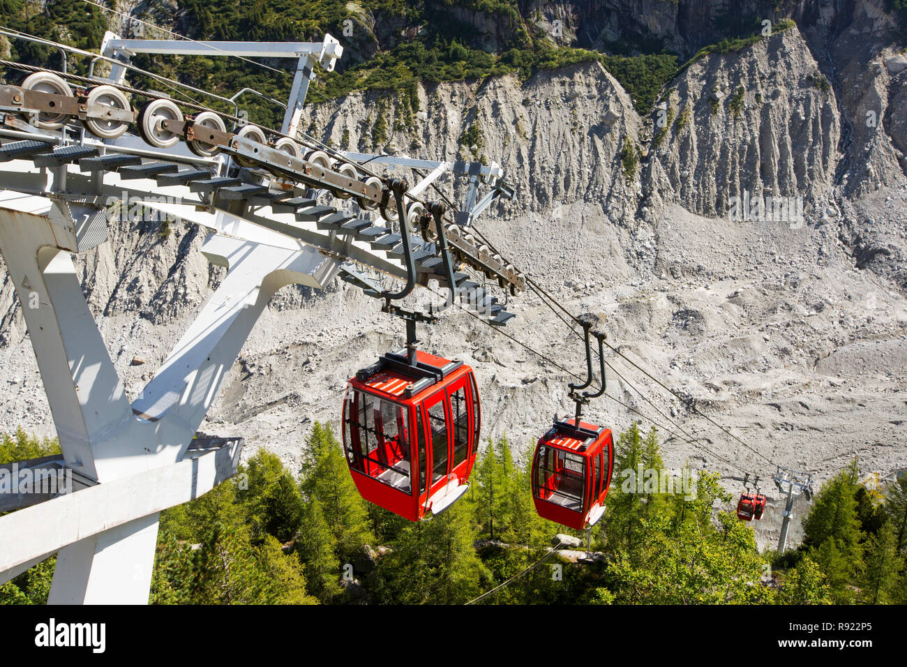 A Cable car taking tourists down from the Montenvers Railway station onto the Mer De Glace. the railway was built in Victorian times to take tourists up to the glacier, it has subsequently thinned 150 meters since 1820, and retreated by 2300 Metres. In order to access the glacier, a cable car has had to be built to reach the ever shrinking glacier. Stock Photo