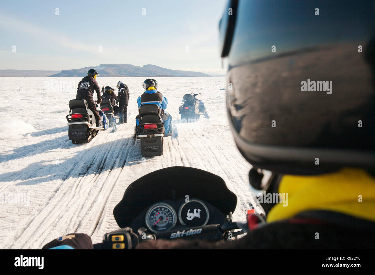 Tourists on a skidoo trip on the Langjokull ice sheet, which is