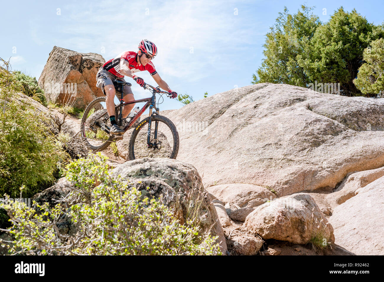 Side view shot of an adventurous mountain biker riding on rocks, Hartmans Rock, Colorado, USA Stock Photo