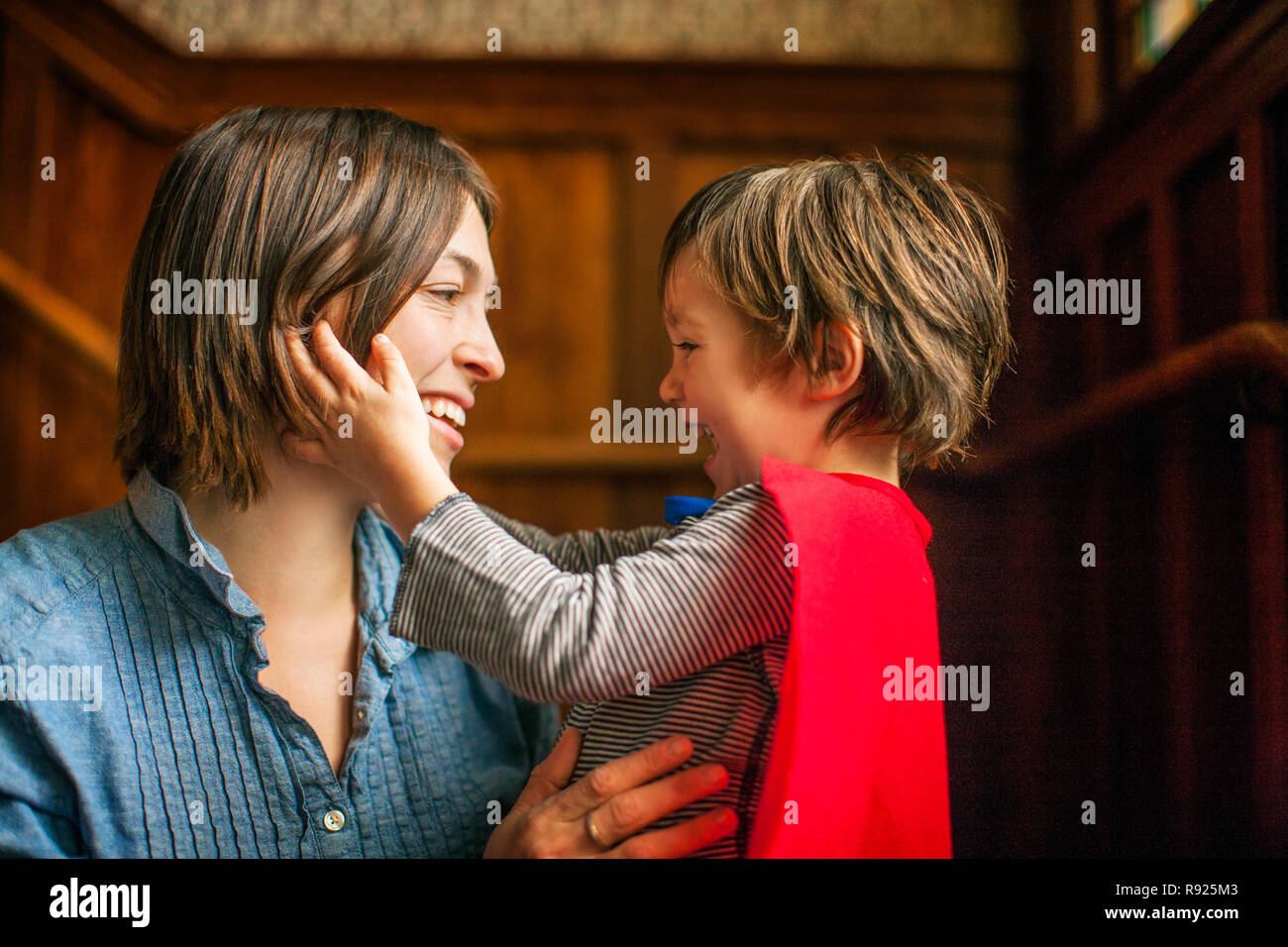 Happy mother and son smiling at one another. Stock Photo