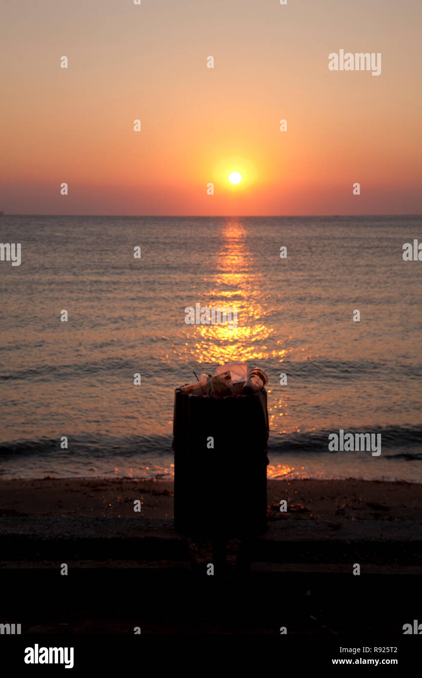 rubbish bin at sunset aegean sea vouliagmeni athens attica greece Stock Photo