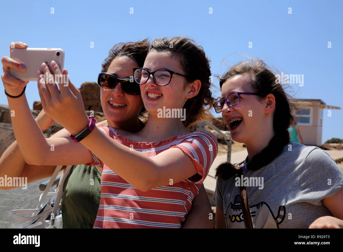 Attica Greece Cape Sounion Mother and Daughters taking Selfie with Smartphone Stock Photo