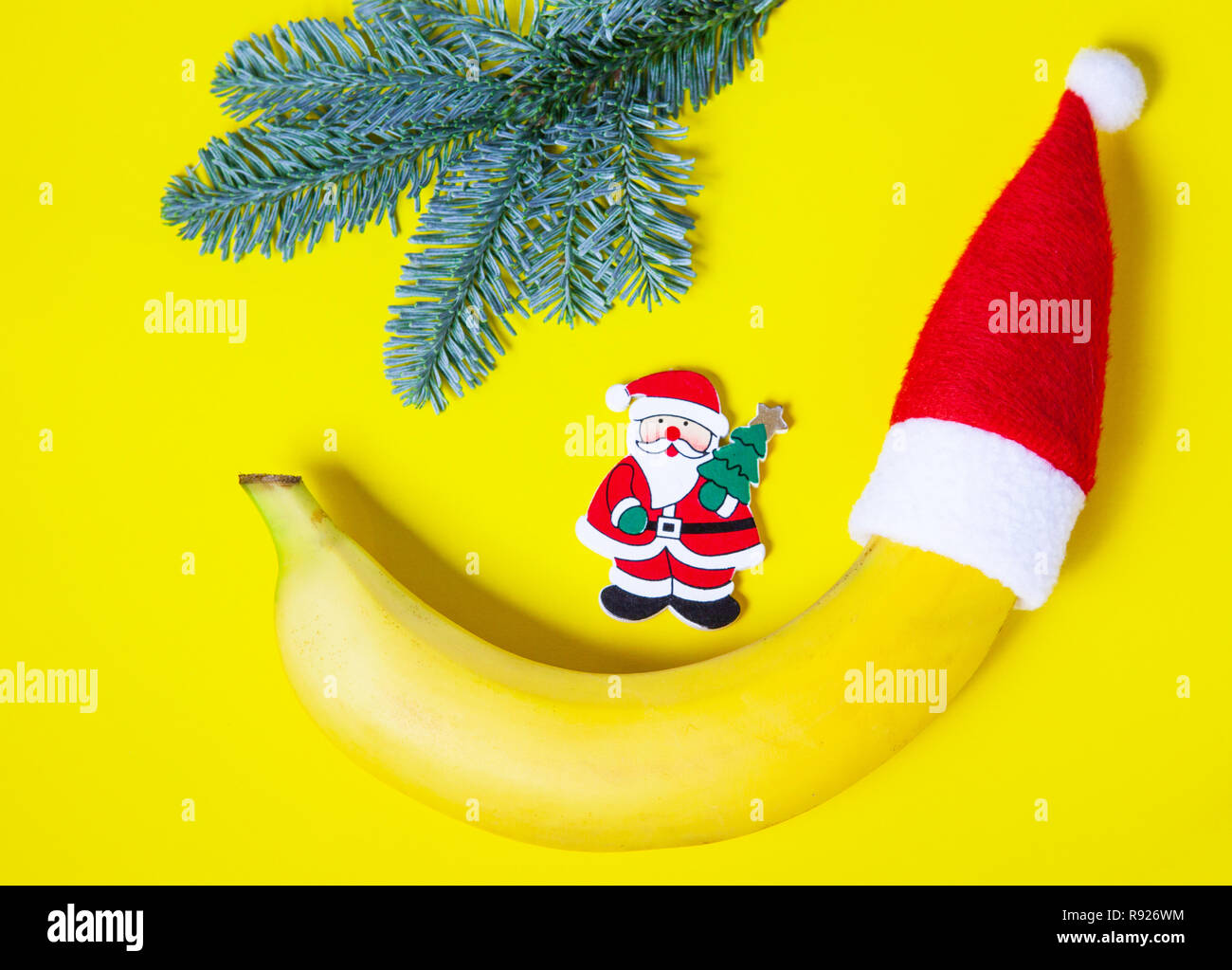 Banana in Santa's cap on a yellow background, joke on Christmas Stock Photo Alamy