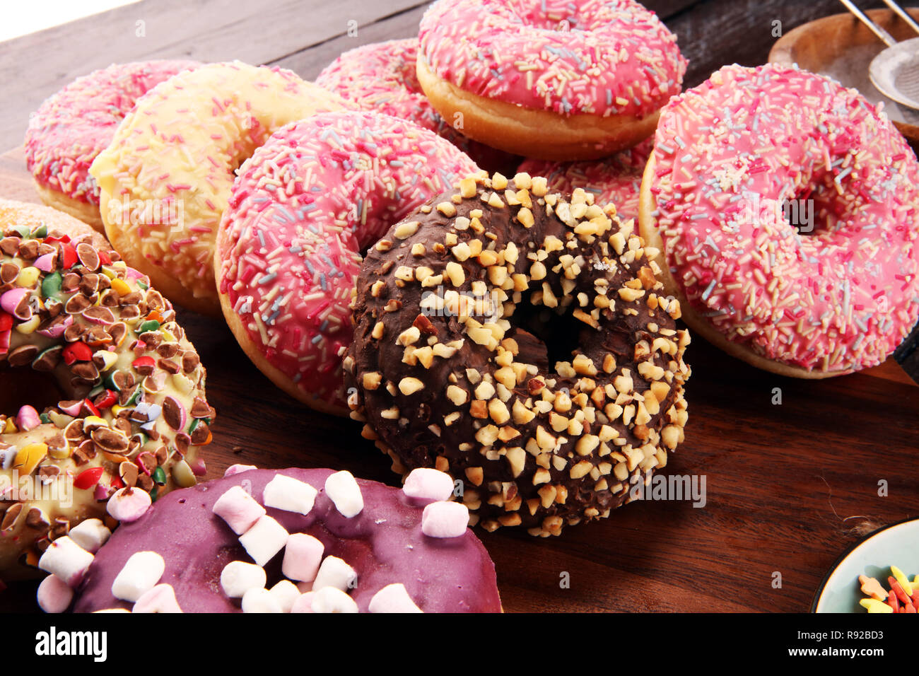 assorted donuts with chocolate frosted, pink glazed and sprinkles ...