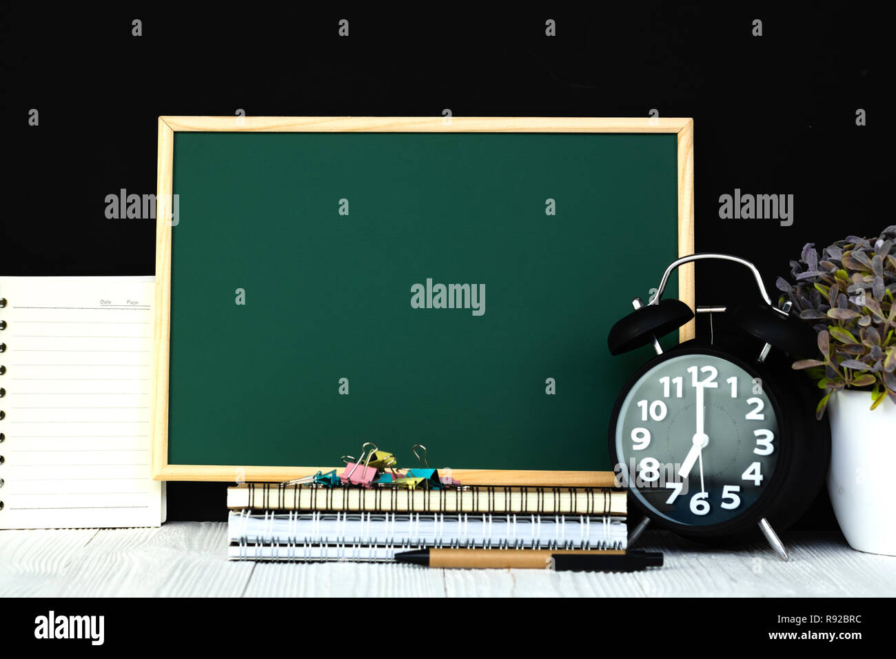 Back to school and education concept idea, green chalkboard with pile ...