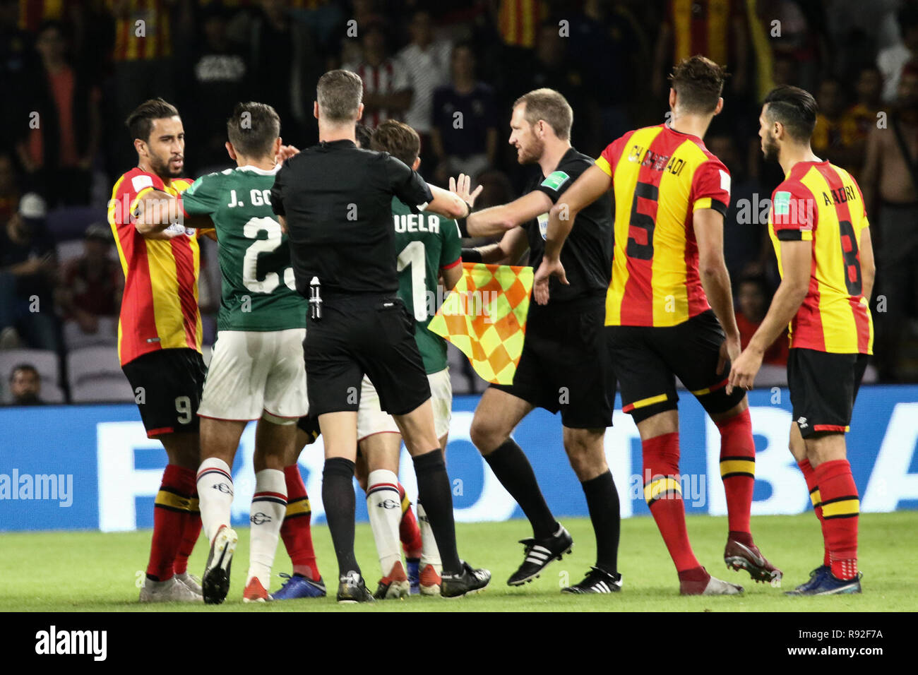 Al Ain, United Arab Emirates. 18th Dec, 2018. Es Tunis and CD Guadalajara players clash during the FIFA Club World Cup fifth place soccer match between ES Tunis and CD Guadalajara at Hazza Bin Zayed Stadium. Credit: Mohamed Flis/dpa/Alamy Live News Stock Photo