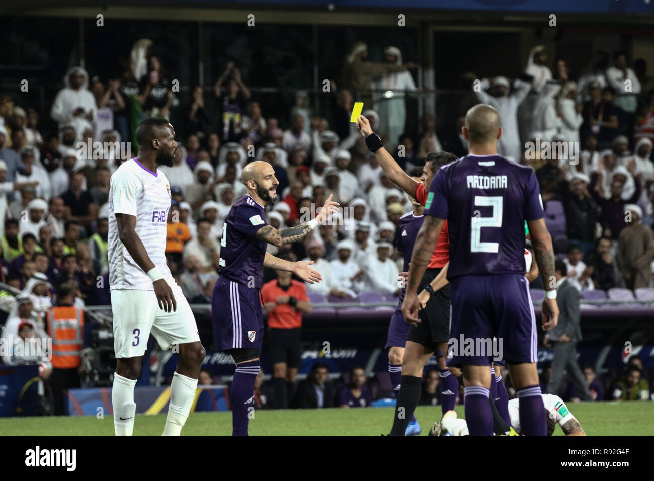 Al Ain, United Arab Emirates. 18th Dec, 2018. River Plate's Javier Pinola is shown a yellow card during the FIFA Club World Cup Semi-Final soccer match between UAE's Al Ain FC and Argentina's River Plate at Hazza Bin Zayed Stadium. Credit: Mohamed Flis/dpa/Alamy Live News Stock Photo