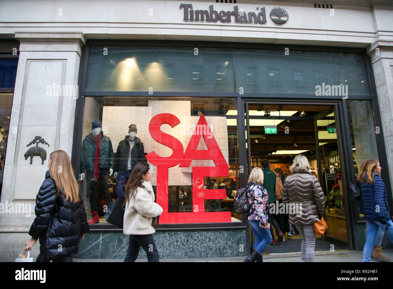 London, UK. 18th Dec, 2018. Shoppers are seen by a Timberland store on  London's Oxford Street with 6 days to Christmas Day. Retailers are  expecting a rush of shoppers in the lead-up