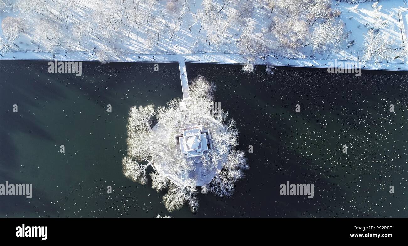 Lhasa, China's Tibet Autonomous Region. 19th Dec, 2018. Aerial photo shows the view of a snow-covered park in Lhasa, capital of southwest China's Tibet Autonomous Region, Dec. 19, 2018. Lhasa witnessed the first snow this winter on Tuesday. Credit: Purbu Zhaxi/Xinhua/Alamy Live News Stock Photo