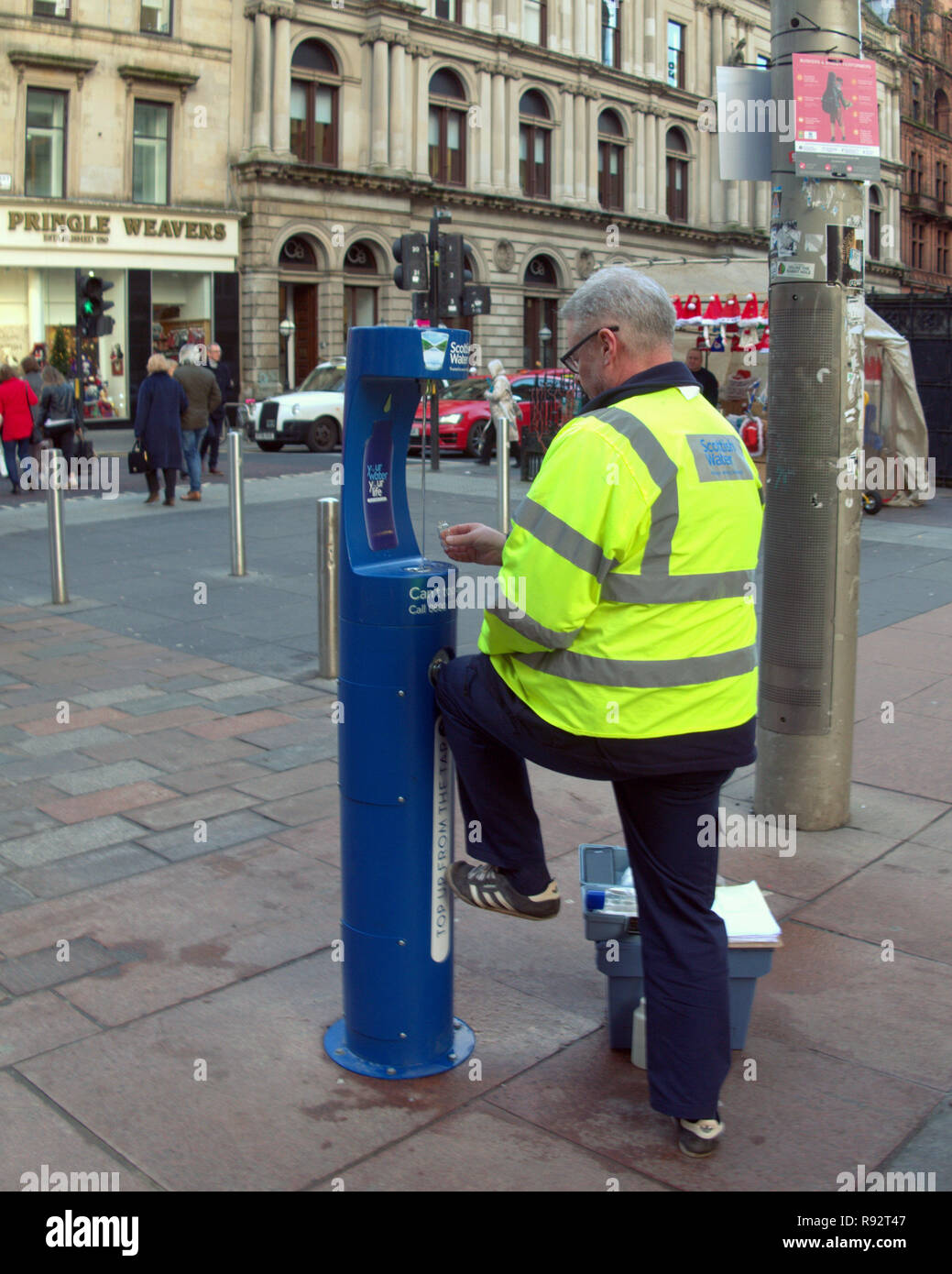 Glasgow, Scotland, UK, 19th December. Scottish Water’s latest Top up Tap will be switched on in Glasgow’s bustling Buchanan Street today to keep festive shoppers hydrated in the countdown to Christmas Only the third in the country and the first in the city its aimed at health and plastic pollution reduction allowing shoppers to fill their own bottles while out. Credit Gerard Ferry/Alamy Live News Stock Photo