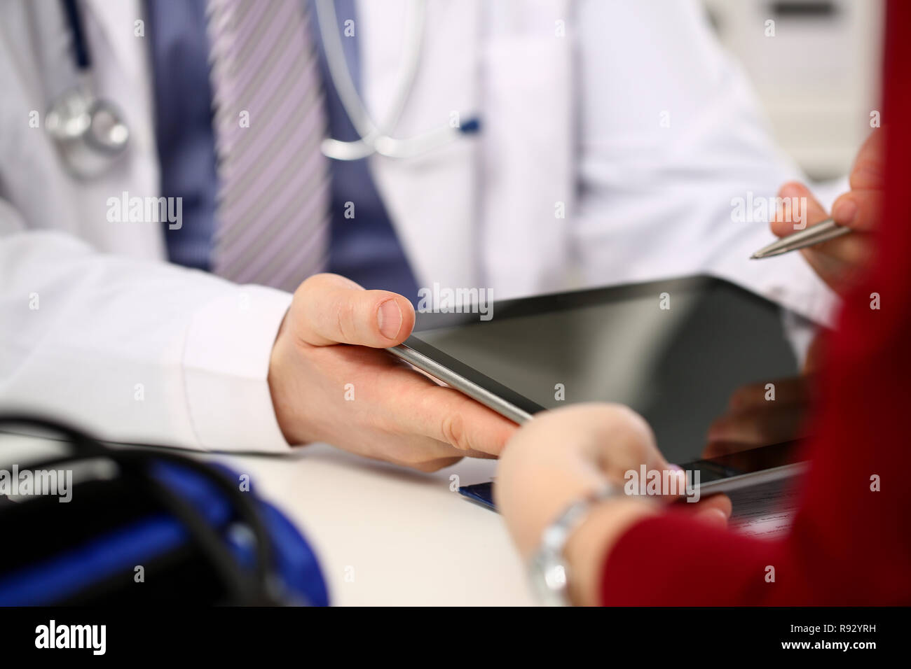 Female doctor hands hold and show digital Stock Photo