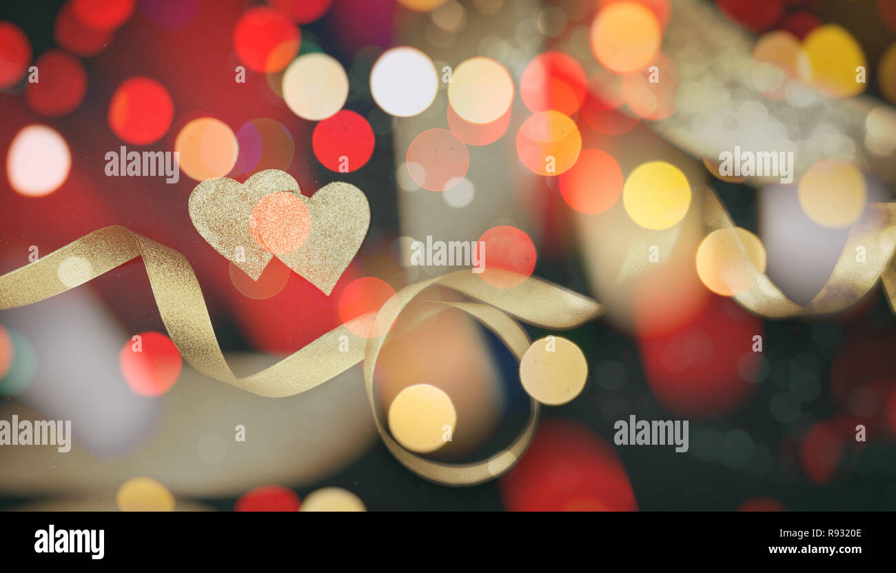 Valentines Day Top View Of Red And Golden Hearts With Satin Ribbon Against Black Background Bokeh Wallpaper Stock Photo Alamy