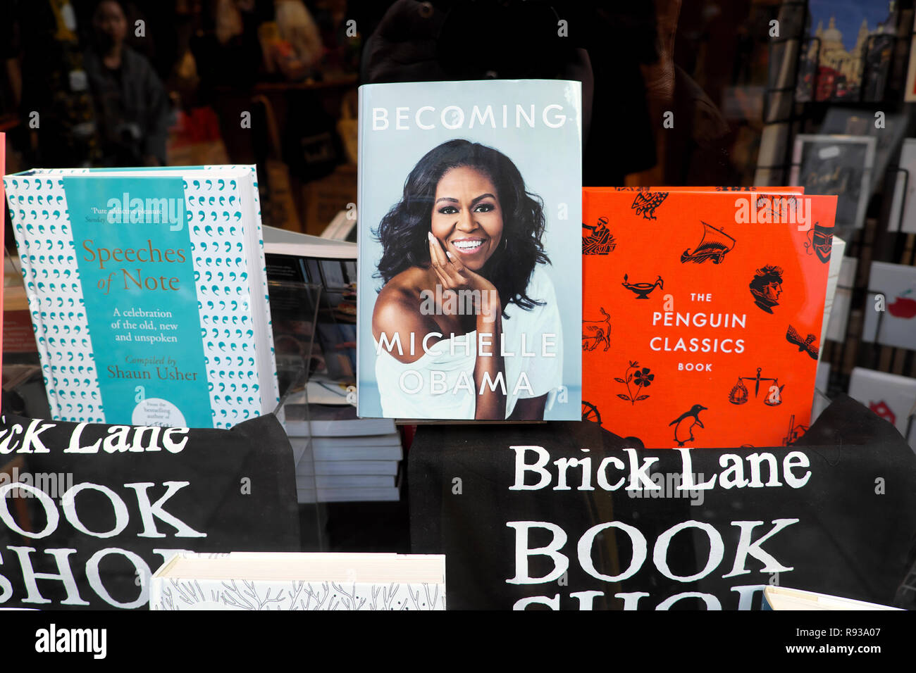 Michelle Obama book 'Becoming' on display with Penguin Classics and Speeches of Note in Brick Lane Book Shop window Shoreditch London  UK KATHY DEWITT Stock Photo