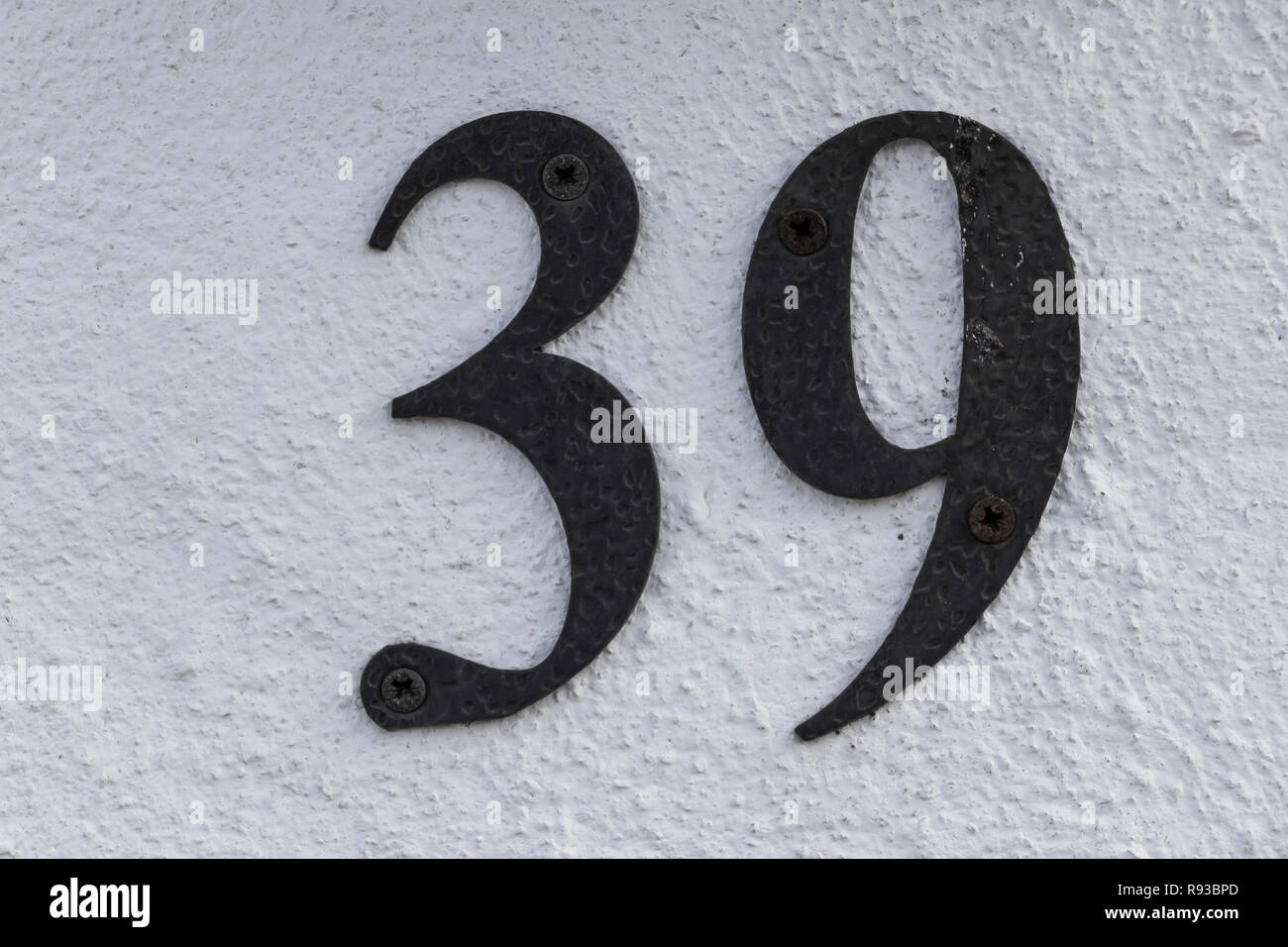 Close up shot of door with numerals 39, number thirty nine Stock Photo