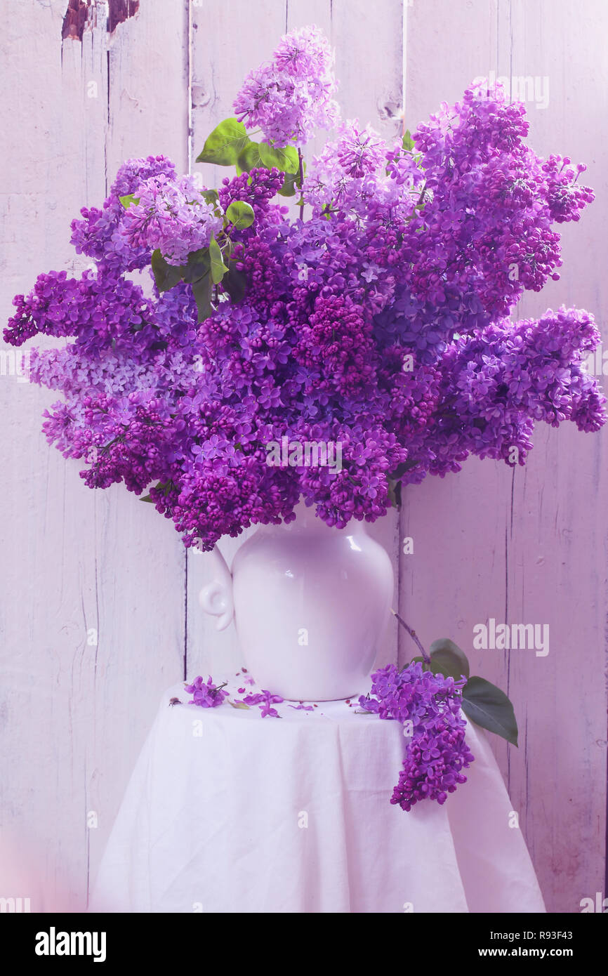 Still life with a bouquet of lilacs Stock Photo - Alamy