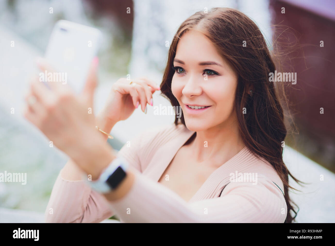 Close up sunny portrait of young happy pretty girl making selfie and ...