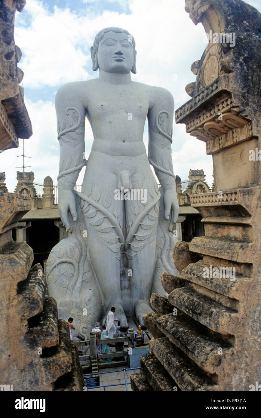 58.8 feet monolithic Statue of jain saint Gomateshwara Lord Bahubali in mahamastakabhisheka on Vindhyagiri hill, Shravanbelagola, Karnataka, India Stock Photo