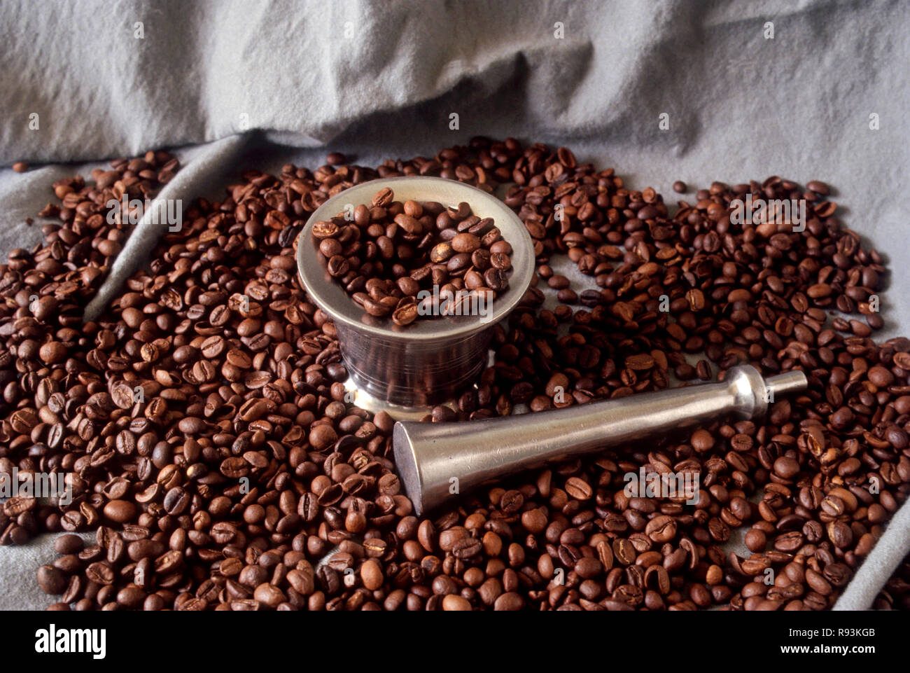 Coffee beans with steel Mortar & Pestle Stock Photo Alamy