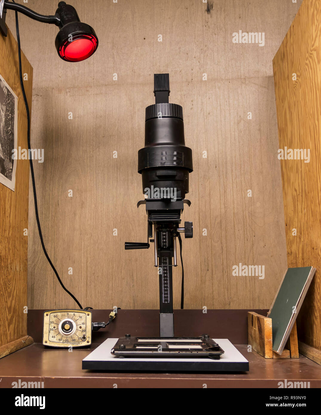 A enlarger in a darkroom set up to print black and white photos Stock