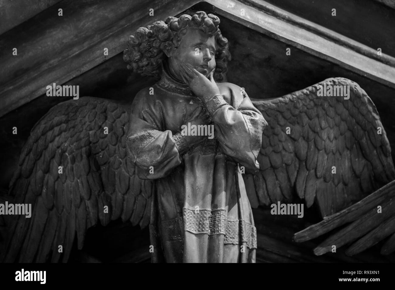 sculpture of an angel with dark background Stock Photo - Alamy