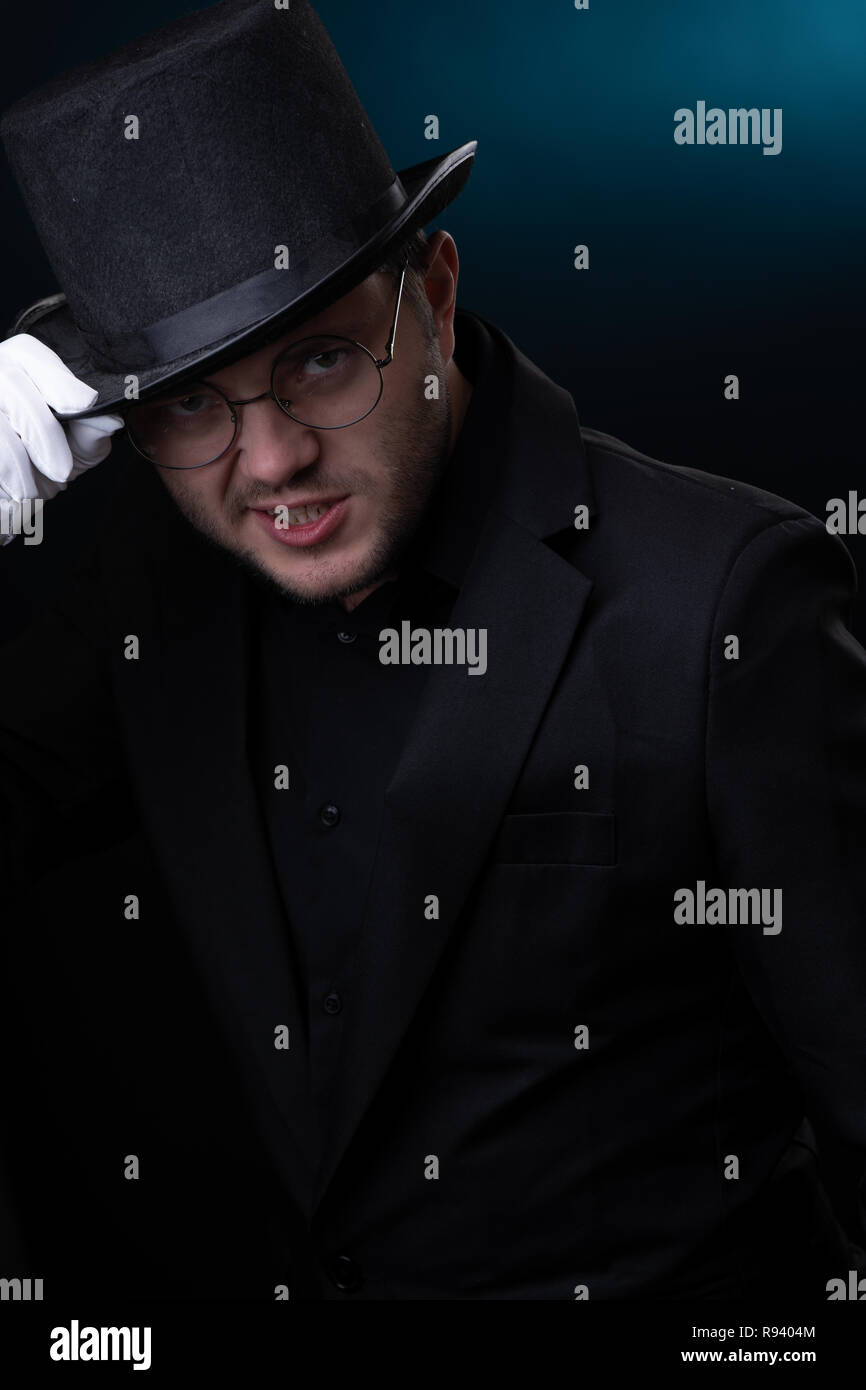 Picture of happy man in black hat in white gloves Stock Photo