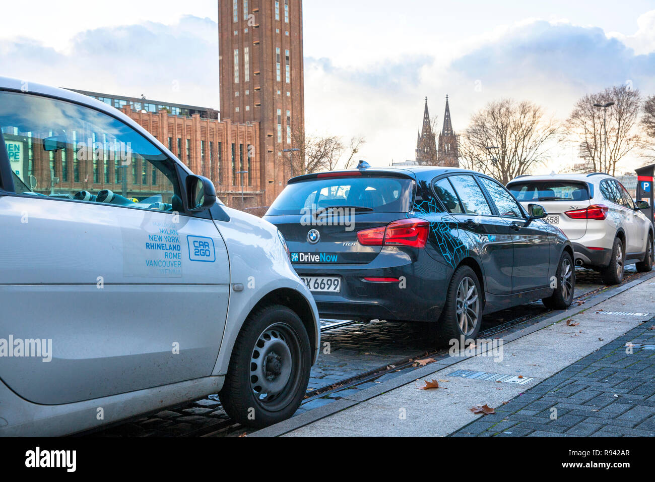 cars of the carsharing companies Drive Now and Car2Go in the district Deutz, Cologne, Germany.  Fahrzeuge der carsharing Unternehmen Drive Now und Car Stock Photo