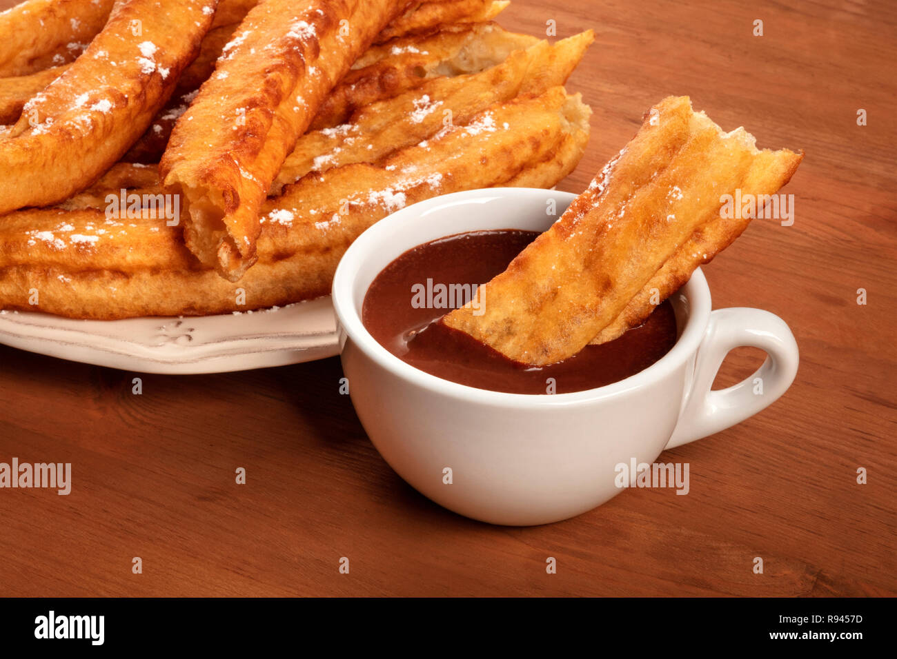 Traditional Spanish porras dipped in hot chocolate, a typical Madrid