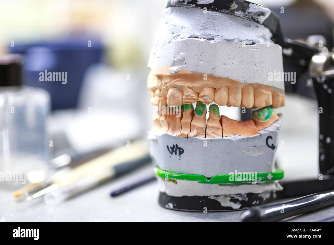 Dental articulator in dental lab. Closeup of device used in Making