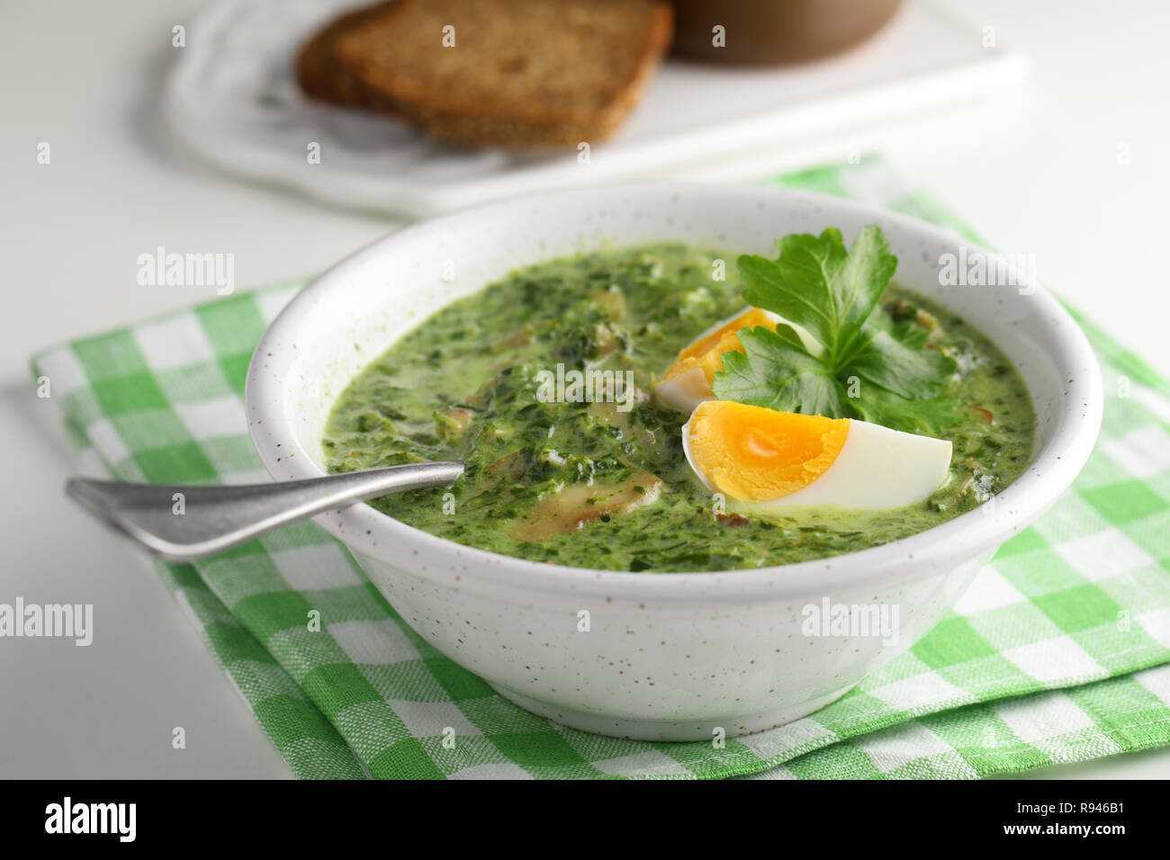 Spinach cream soup with mushrooms and boiled eggs Stock Photo