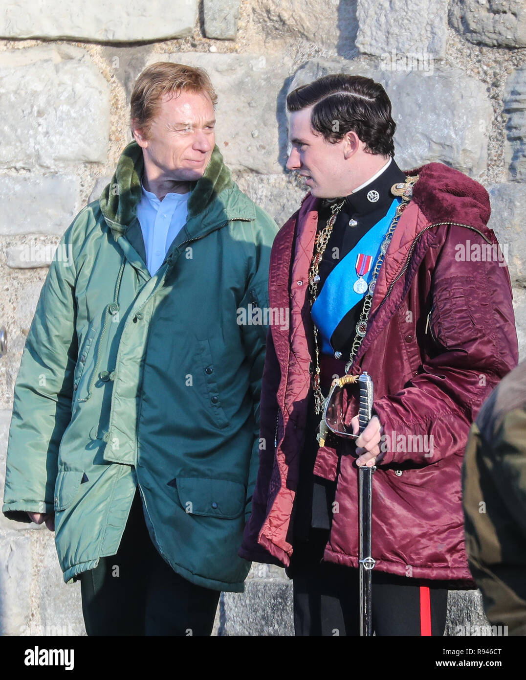 Olivia Colman, Josh O'Connor and Tobias Menzies film a scene for the Netflix drama at Caernarfon Castle. The Queen presents the newly invested Prince of Wales to the Welsh people from Queen Eleanor's Gate.  Featuring: Ben Daniels, Josh O'Connor Where: Caernafon, United Kingdom When: 18 Nov 2018 Credit: WENN.com Stock Photo